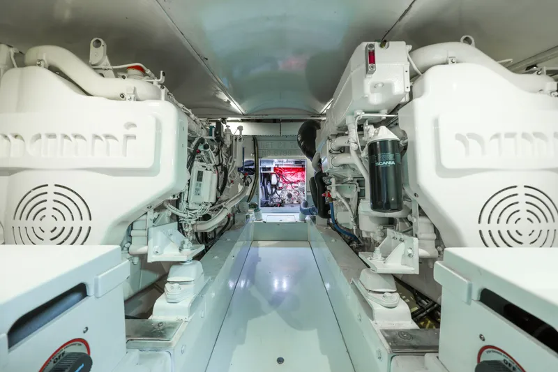 Smoke Show Yacht Photos Pics Engine room of a 1985 Monterey Convertible boat, clean and well-organized.