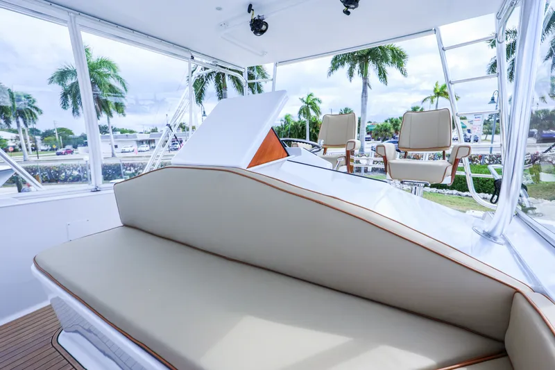 Smoke Show Yacht Photos Pics Interior of a 1985 Monterey Convertible with beige seating.