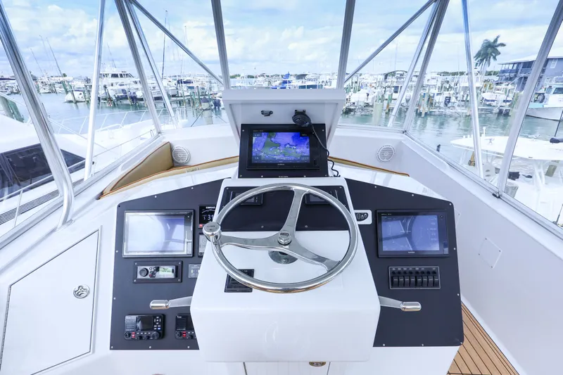 Smoke Show Yacht Photos Pics Helm of a 1985 Monterey Convertible boat in harbor.