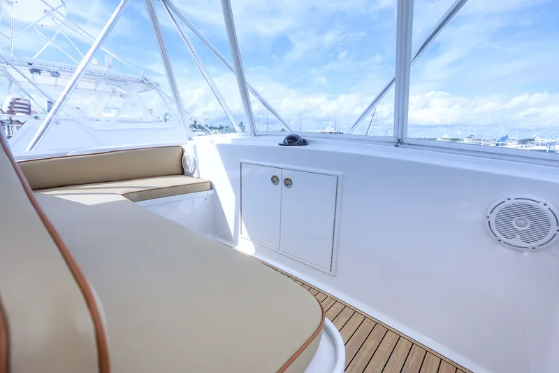 Smoke Show Yacht Photos Pics Interior of a 1985 Monterey Convertible boat with seating area.