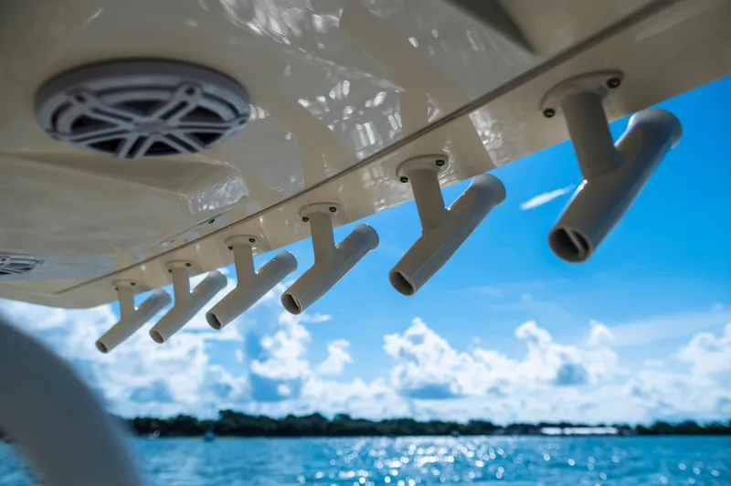  Yacht Photos Pics 2019 Scout 355 LXF boat rod holders against a sunny ocean backdrop.