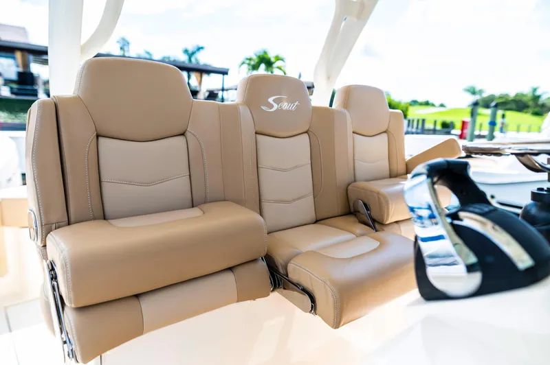  Yacht Photos Pics Luxurious seating on 2019 Scout 355 LXF boat, featuring beige leather upholstery and modern design.