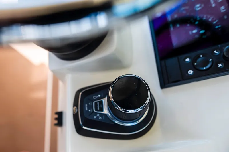  Yacht Photos Pics Control panel of 2019 Scout 355 LXF boat with joystick and display.