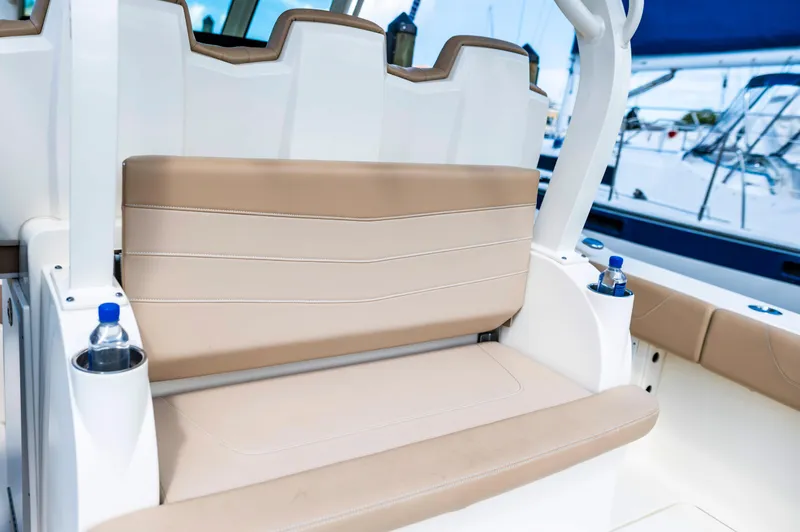  Yacht Photos Pics 2019 Scout 355 LXF boat seating with beige cushions and cup holders.
