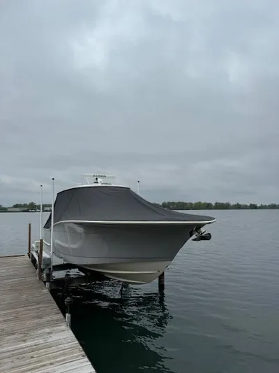  Yacht Photos Pics 2019 Scout 355 LXF boat docked on a cloudy day.