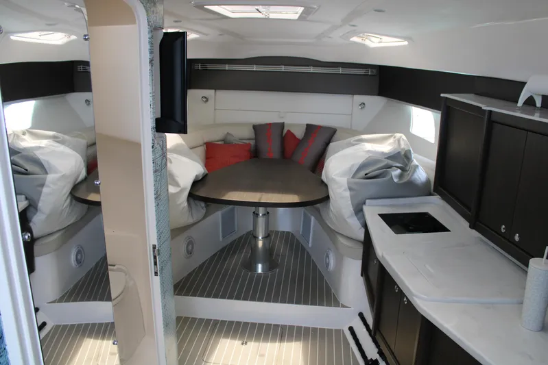 No Ultimatum Yacht Photos Pics Interior of 2020 Intrepid 475 Sport Yacht with modern furnishings and compact kitchen.