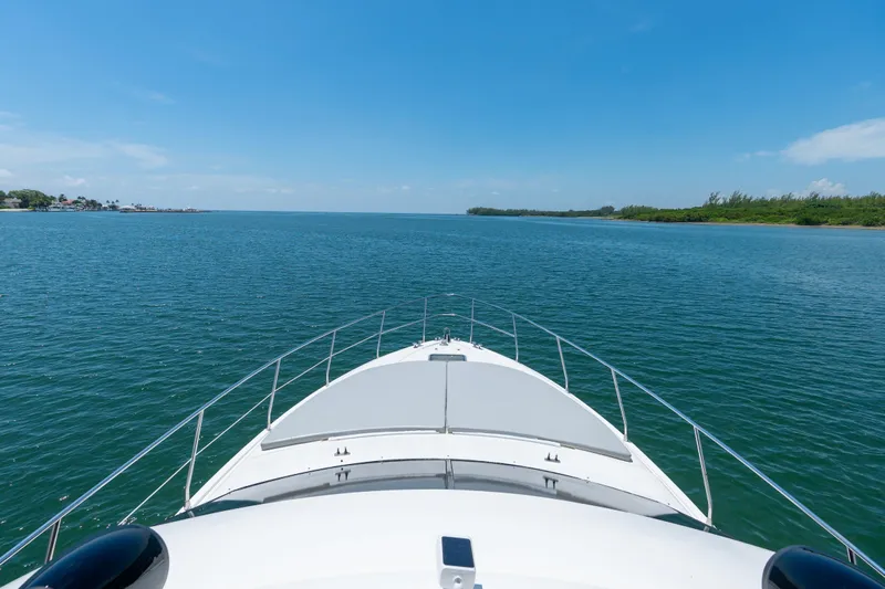  Yacht Photos Pics Bow view of 1998 Azimut 43 Fly yacht cruising on open water.