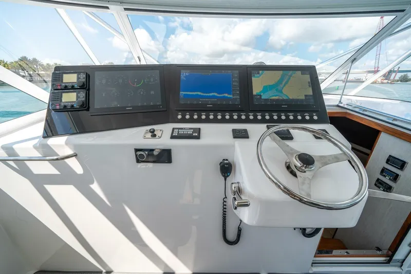 Big Hit Yacht Photos Pics Helm of 2020 Cabo 40 Express yacht with advanced navigation displays and controls.