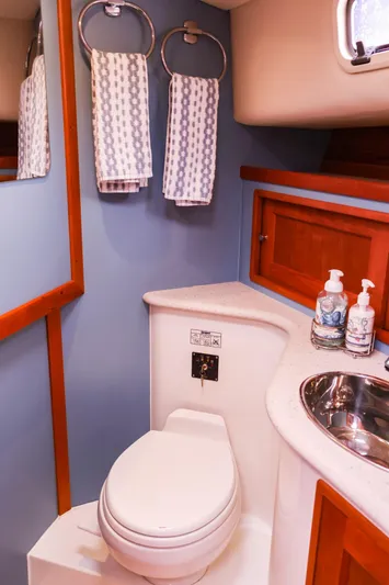 4709tw Yacht Photos Pics 2010 MJM 40z Downeast boat bathroom with toilet, sink, and towels.