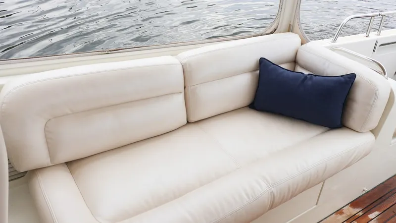 4709tw Yacht Photos Pics Luxurious white leather seating on 2010 MJM 40z Downeast boat with navy cushion.