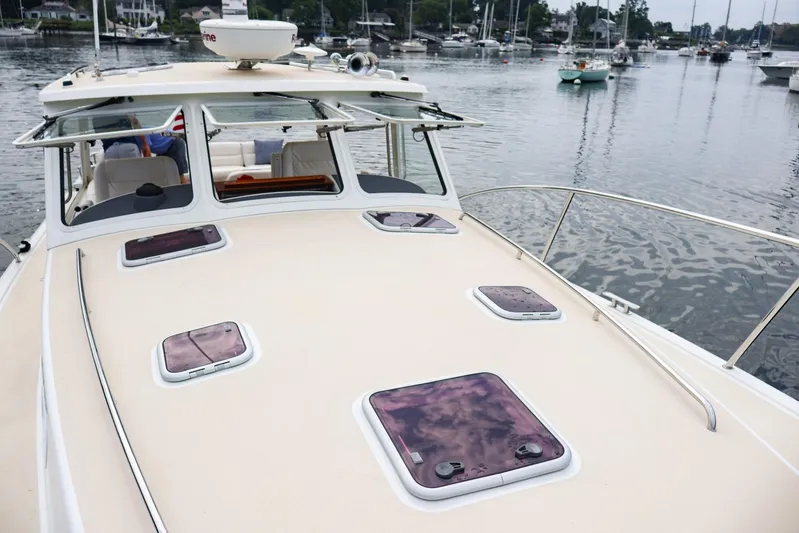 4709tw Yacht Photos Pics 2010 MJM 40z Downeast boat docked in a marina.