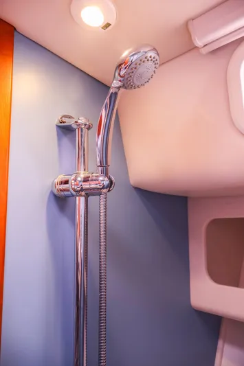 4709tw Yacht Photos Pics 2010 MJM 40z Downeast yacht shower with chrome fixtures and blue wall.