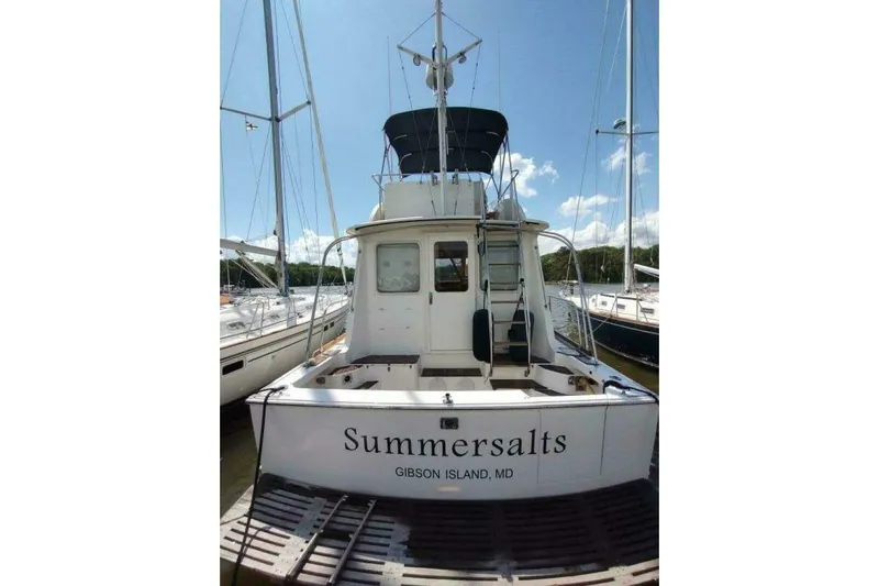 Summersalts Yacht Photos Pics 1996 Grand Banks Eastbay 40 Flybridge yacht docked, named "Summersalts," at Gibson Island, MD.