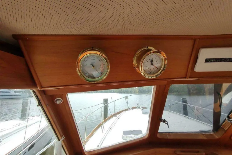 Summersalts Yacht Photos Pics Interior view of 1996 Grand Banks Eastbay 40 Flybridge with nautical instruments.