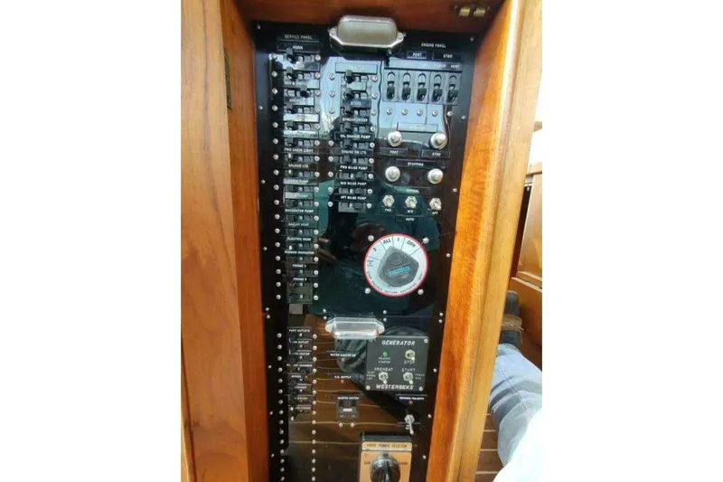 Summersalts Yacht Photos Pics Electrical panel of 1996 Grand Banks Eastbay 40 Flybridge boat, featuring switches and gauges.