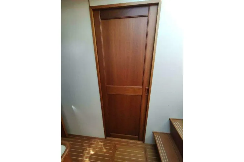 Summersalts Yacht Photos Pics Wooden interior door and stairs on 1996 Grand Banks Eastbay 40 Flybridge yacht.