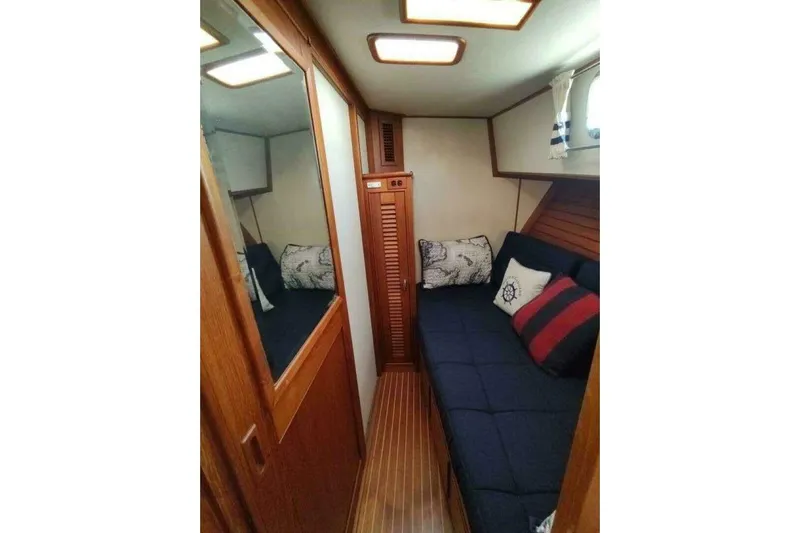 Summersalts Yacht Photos Pics Cozy cabin interior of 1996 Grand Banks Eastbay 40 Flybridge with nautical decor.