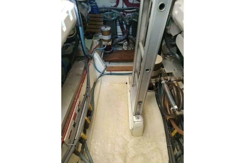 Summersalts Yacht Photos Pics Engine room of 1996 Grand Banks Eastbay 40 Flybridge with visible machinery and wiring.