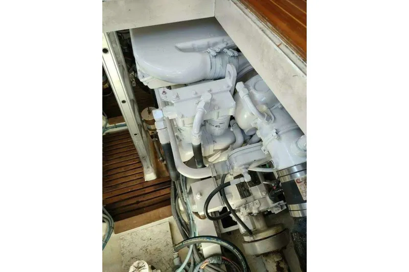 Summersalts Yacht Photos Pics Engine compartment of 1996 Grand Banks Eastbay 40 Flybridge, showcasing mechanical components.