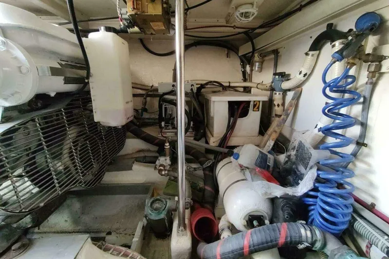 Summersalts Yacht Photos Pics Engine room of 1996 Grand Banks Eastbay 40 Flybridge with various mechanical components.
