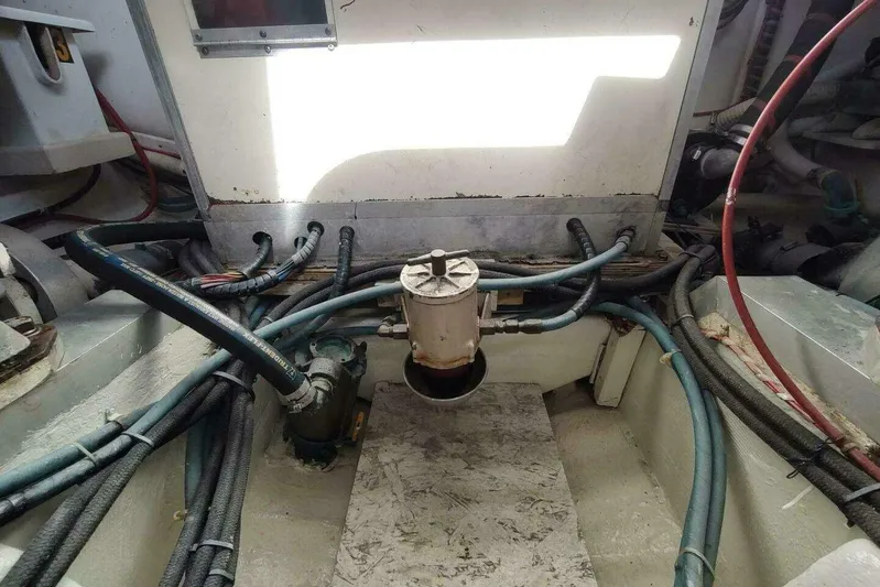 Summersalts Yacht Photos Pics Engine room of 1996 Grand Banks Eastbay 40 Flybridge with visible hoses and components.