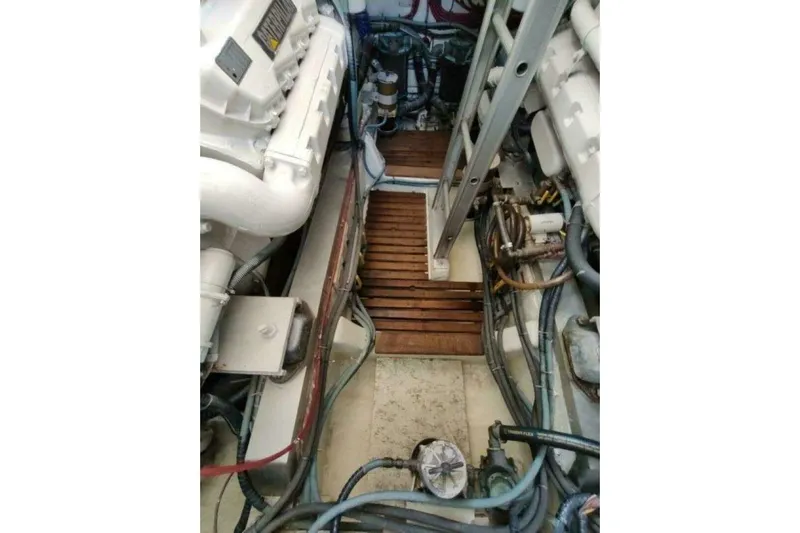 Summersalts Yacht Photos Pics Engine room of 1996 Grand Banks Eastbay 40 Flybridge with visible machinery and components.
