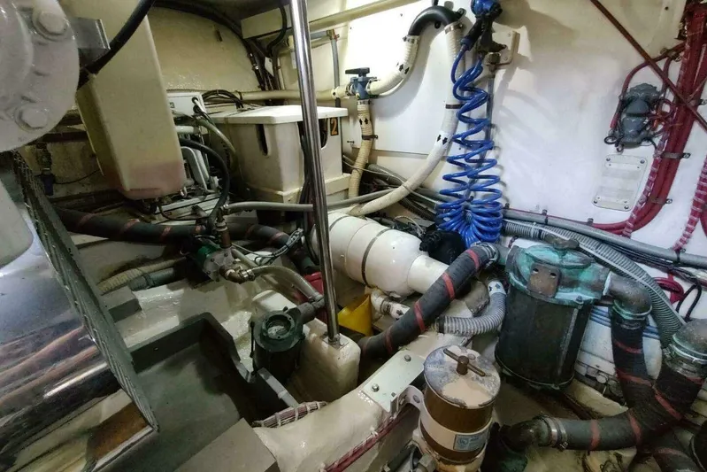 Summersalts Yacht Photos Pics Engine room of 1996 Grand Banks Eastbay 40 Flybridge with complex piping and machinery.