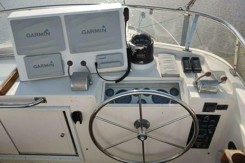 Summersalts Yacht Photos Pics Helm of 1996 Grand Banks Eastbay 40 Flybridge with Garmin navigation equipment.