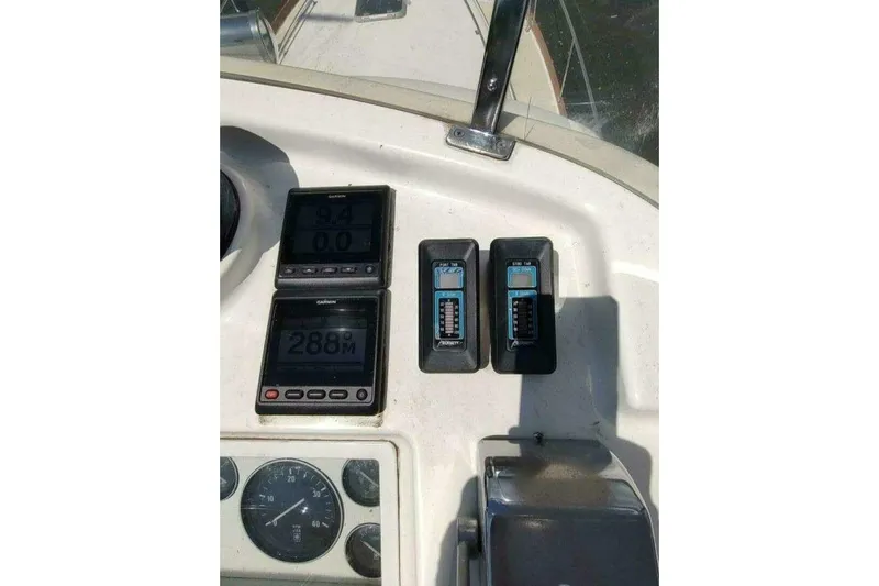 Summersalts Yacht Photos Pics 1996 Grand Banks Eastbay 40 Flybridge dashboard with navigation instruments and gauges.