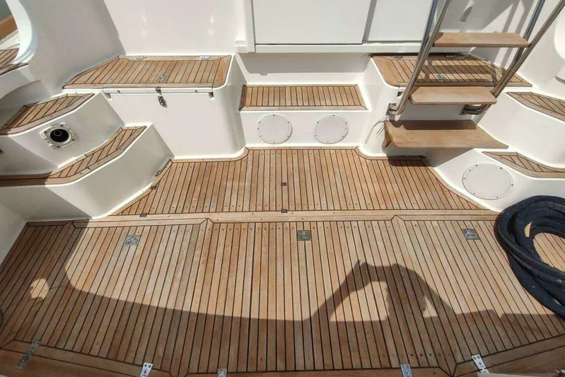 Summersalts Yacht Photos Pics Teak deck of 1996 Grand Banks Eastbay 40 Flybridge with steps and storage compartments.