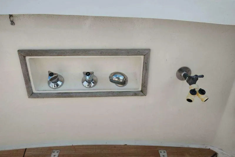 Summersalts Yacht Photos Pics Control panel and faucet on 1996 Grand Banks Eastbay 40 Flybridge boat.