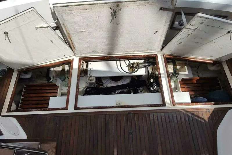 Summersalts Yacht Photos Pics Engine compartment of 1996 Grand Banks Eastbay 40 Flybridge with open hatches and visible components.