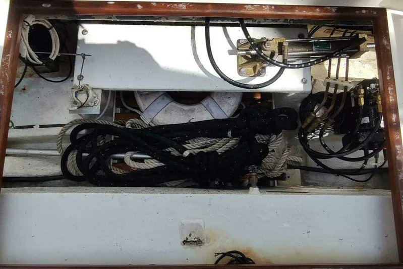 Summersalts Yacht Photos Pics Storage compartment of a 1996 Grand Banks Eastbay 40 Flybridge with ropes and equipment.