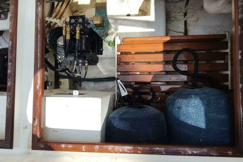 Summersalts Yacht Photos Pics 1996 Grand Banks Eastbay 40 Flybridge engine compartment with equipment and storage.