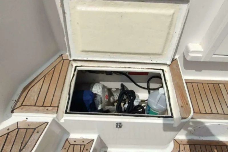 Summersalts Yacht Photos Pics Open storage compartment on 1996 Grand Banks Eastbay 40 Flybridge boat deck.