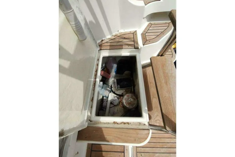 Summersalts Yacht Photos Pics Open storage compartment on 1996 Grand Banks Eastbay 40 Flybridge boat deck.