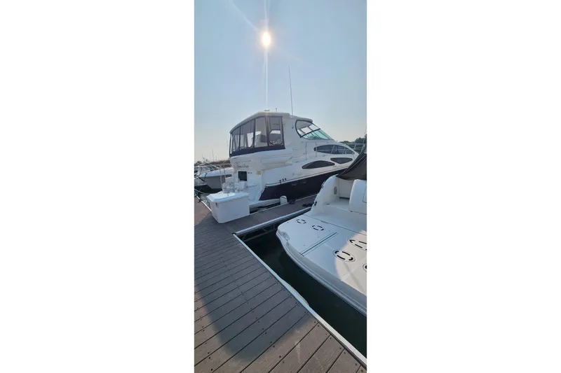  Yacht Photos Pics 2008 CRUISERS INC 415 Express Motoryacht docked under bright sun.