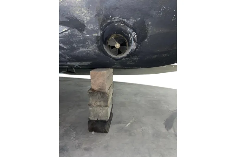  Yacht Photos Pics 2008 CRUISERS INC 415 Express Motoryacht hull with propeller, supported by wooden blocks.