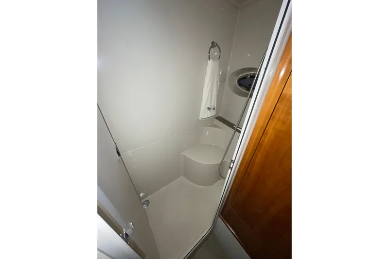  Yacht Photos Pics Bathroom interior of 2008 CRUISERS INC 415 Express Motoryacht, featuring shower and towel ring.