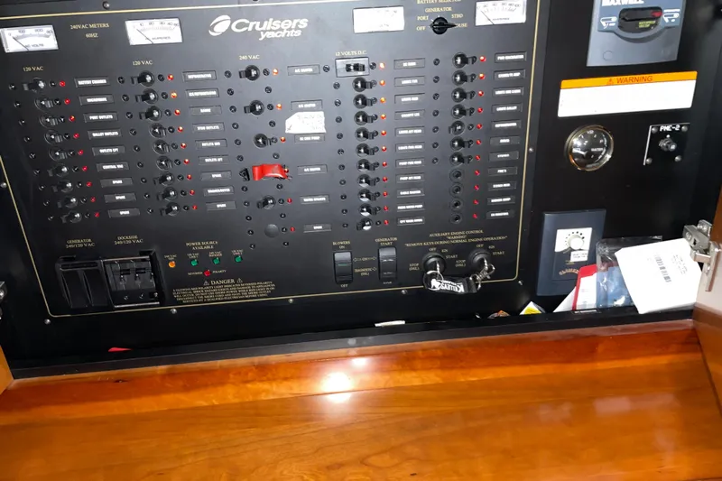  Yacht Photos Pics Electrical control panel of 2008 CRUISERS INC 415 Express Motoryacht, featuring various switches and meters.