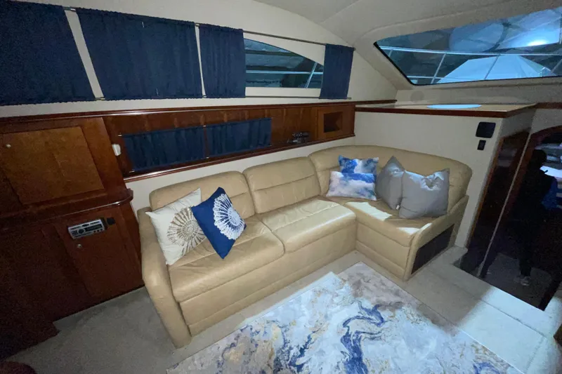  Yacht Photos Pics Luxurious interior of 2008 CRUISERS INC 415 Express Motoryacht with beige leather sofa and decorative pillows.