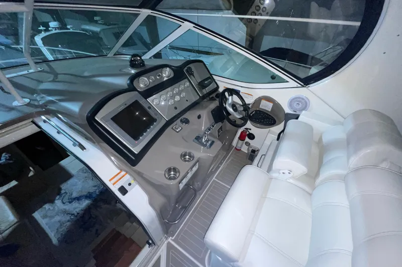  Yacht Photos Pics 2008 CRUISERS INC 415 Express Motoryacht helm with modern controls and white seating.