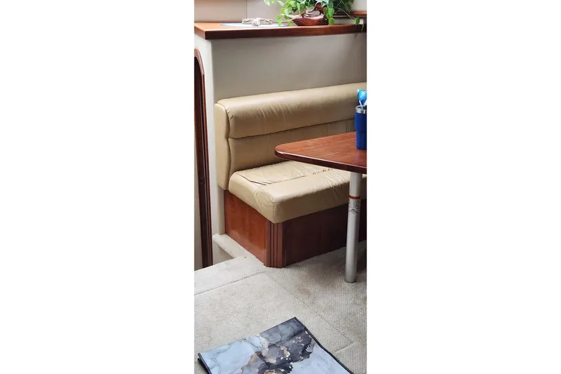  Yacht Photos Pics Interior of 2008 CRUISERS INC 415 Express Motoryacht with beige seating and wooden table.