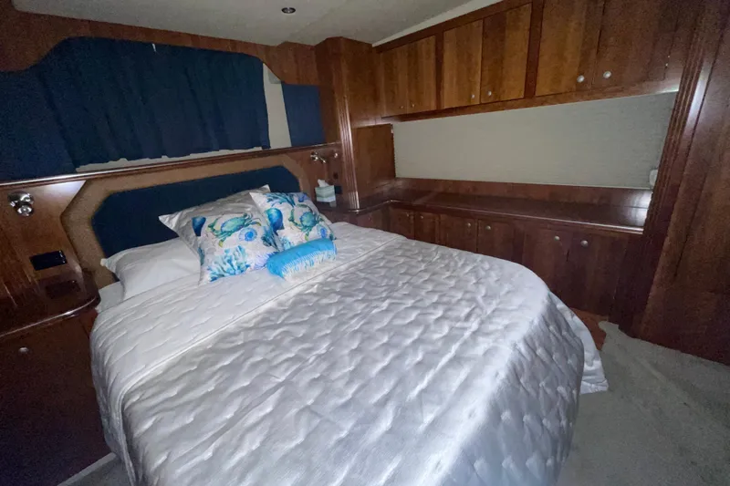  Yacht Photos Pics Luxurious bedroom in 2008 CRUISERS INC 415 Express Motoryacht with elegant wood cabinetry.