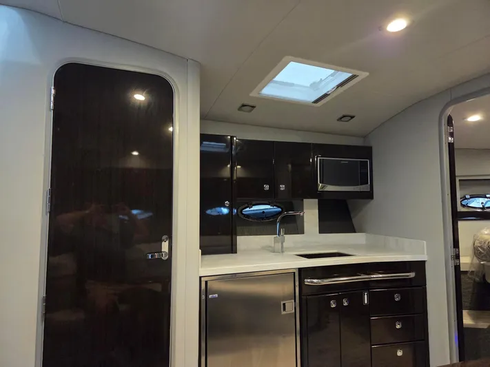 Sea Wings Yacht Photos Pics Luxurious 2017 Formula 20127 yacht interior with modern kitchen and sleek cabinetry.