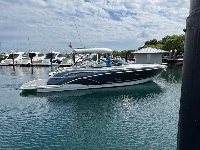  Yacht Photos Pics 2017 Formula 350 CBR boat docked in a marina under a cloudy sky.