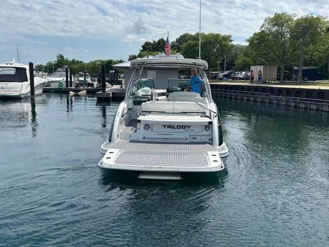  Yacht Photos Pics 2017 Formula 350 CBR boat named Trilogy docked in a marina.