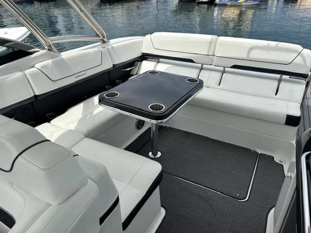  Yacht Photos Pics 2017 Formula 350 CBR boat interior with white seating and a central table.