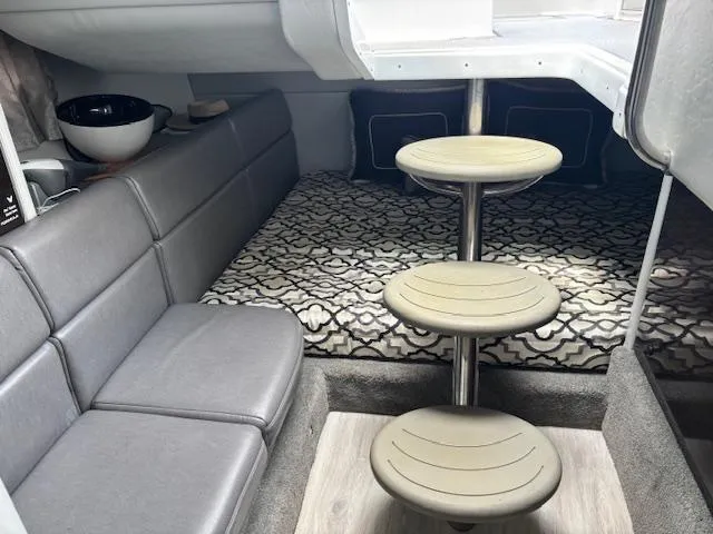 Yacht Photos Pics 2017 Formula 350 CBR cabin interior with gray seating, patterned bedding, and circular steps.
