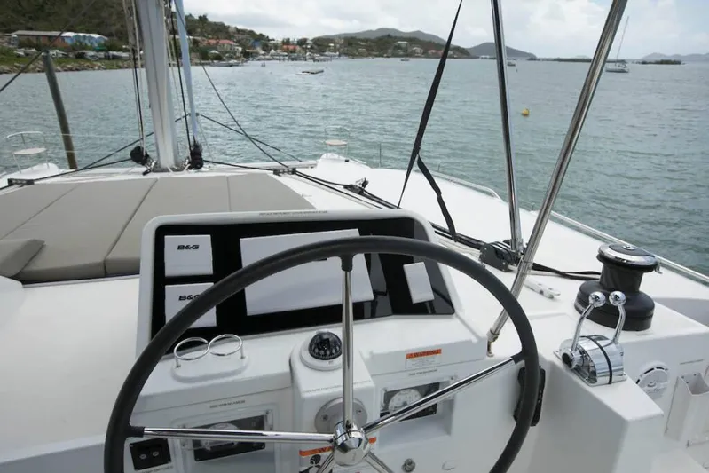  Yacht Photos Pics Helm of 2018 Lagoon 450 F catamaran with scenic coastal view.
